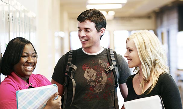 three students smiling